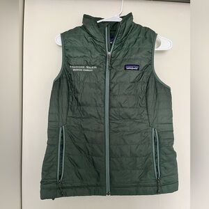 Green Patagonia down vest with company logo